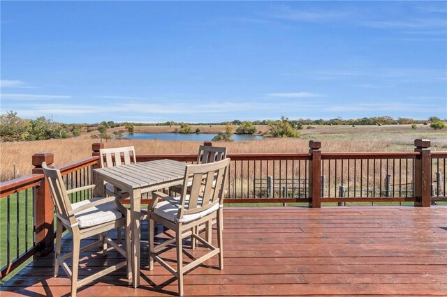 wooden deck with a water view