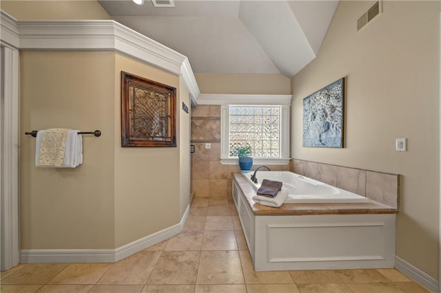 full bath featuring visible vents, a garden tub, vaulted ceiling, tiled shower, and tile patterned floors