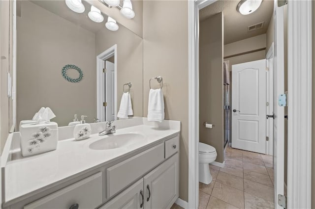 bathroom with visible vents, toilet, a shower with shower curtain, tile patterned floors, and vanity