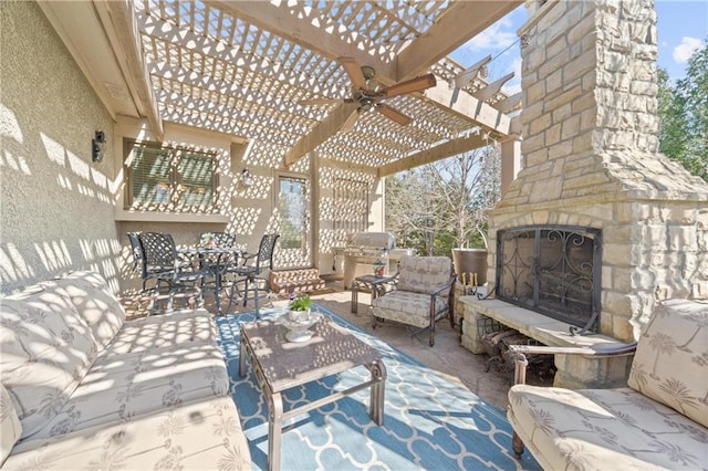 view of patio / terrace featuring an outdoor living space with a fireplace and a pergola