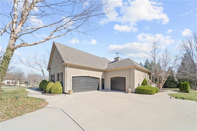 view of property exterior with a chimney, stucco siding, an attached garage, and concrete driveway