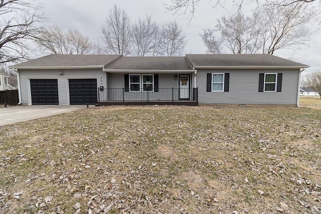 ranch-style house with a garage, concrete driveway, and a porch