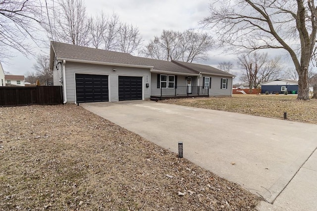 single story home with a garage, fence, and concrete driveway