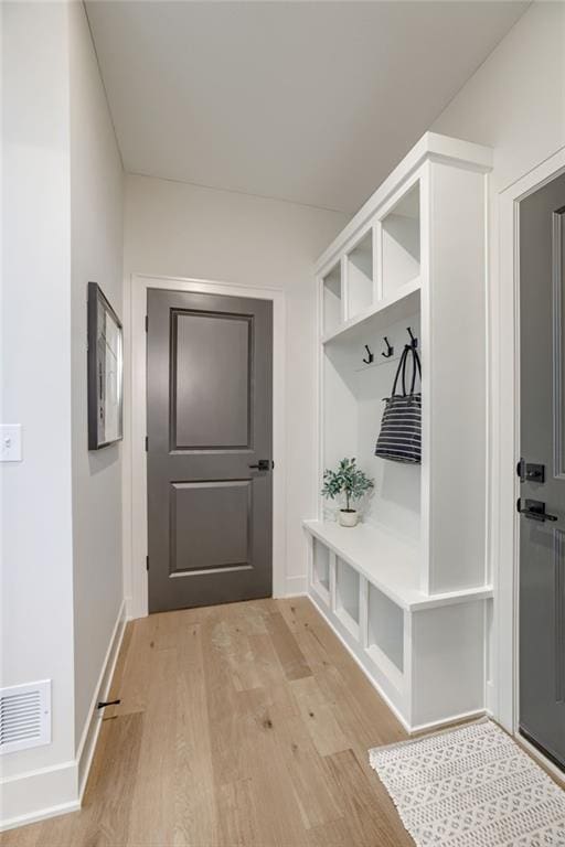 12455 N Arbor Way, Platte City, MO 64079 - mudroom featuring light wood finished floors and baseboards