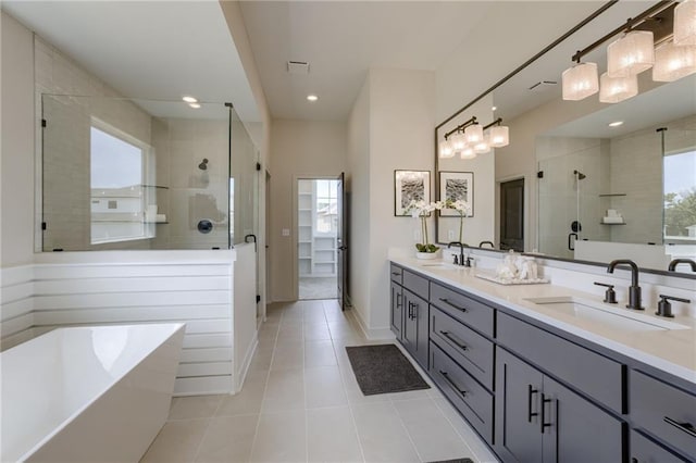 12455 N Arbor Way, Platte City, MO 64079 - full bathroom with a stall shower, double vanity, tile patterned floors, a soaking tub, and recessed lighting