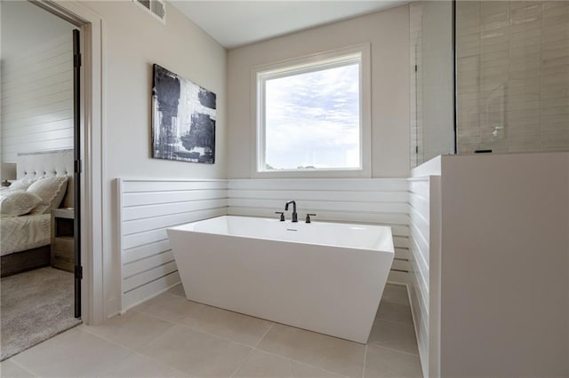 12455 N Arbor Way, Platte City, MO 64079 - ensuite bathroom featuring a freestanding bath, tile patterned floors, and walk in shower