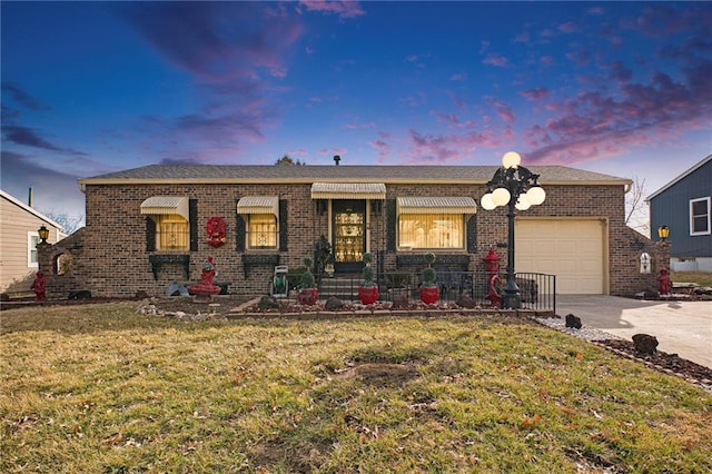 ranch-style home with a front lawn, brick siding, driveway, and an attached garage