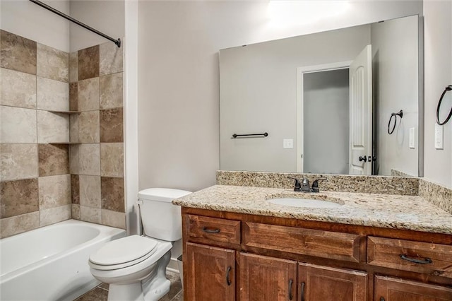 bathroom with vanity, toilet, and shower / bathtub combination