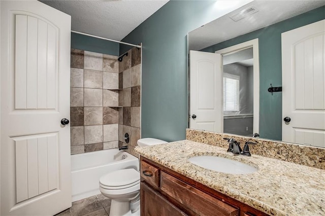 full bath with visible vents, washtub / shower combination, toilet, vanity, and a textured ceiling