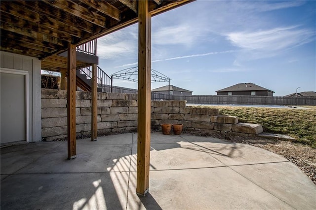 view of patio with a fenced backyard and stairs