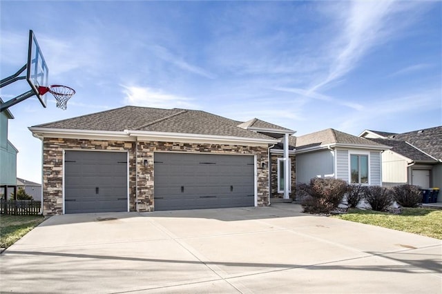 view of front of home featuring stone siding, an attached garage, a shingled roof, and driveway