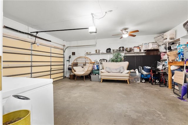 garage featuring fridge, a ceiling fan, and a garage door opener