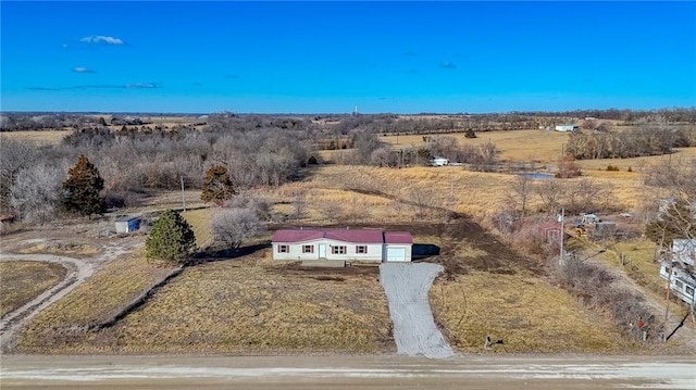 birds eye view of property featuring a rural view