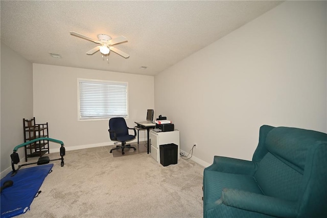 carpeted office space featuring a textured ceiling, visible vents, and baseboards