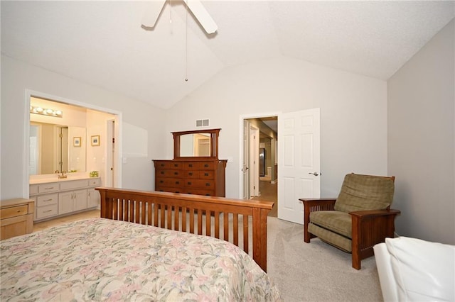 bedroom featuring visible vents, a ceiling fan, connected bathroom, light colored carpet, and vaulted ceiling