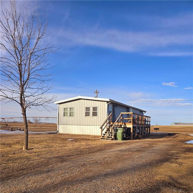 view of front of property featuring a wooden deck