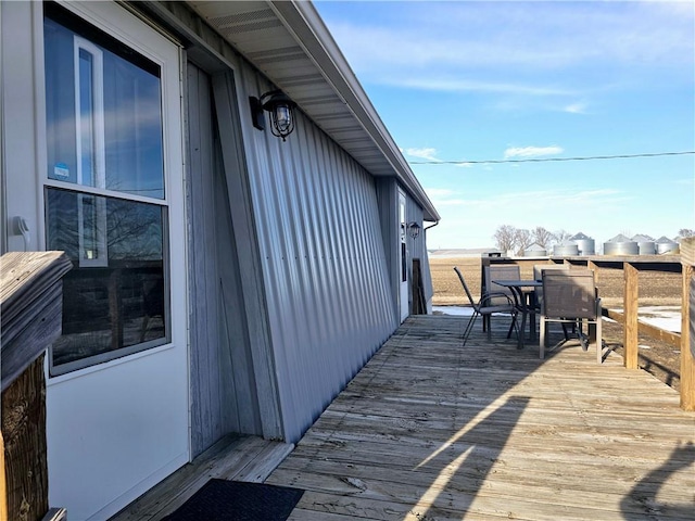 wooden deck with outdoor dining area