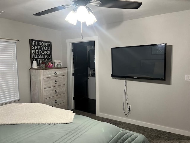 bedroom with ceiling fan, baseboards, and carpet flooring