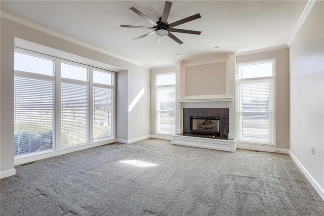 unfurnished living room featuring visible vents, carpet flooring, a fireplace, crown molding, and baseboards