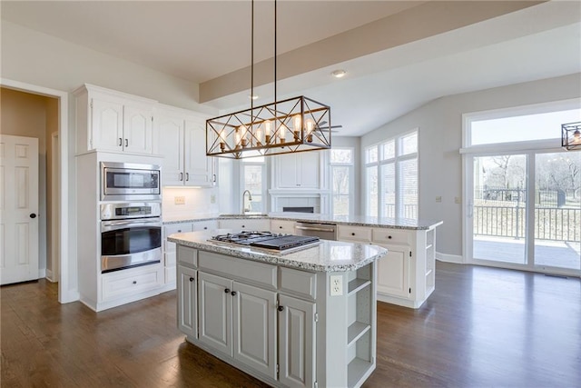 kitchen with open shelves, dark wood-style floors, a center island, appliances with stainless steel finishes, and a peninsula