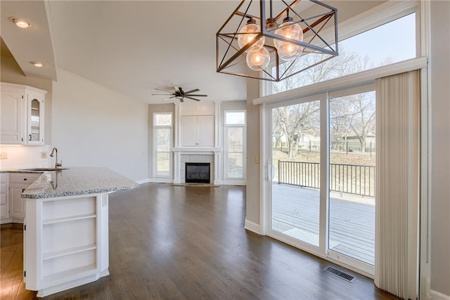 kitchen featuring a ceiling fan, visible vents, open shelves, dark wood-style flooring, and white cabinetry