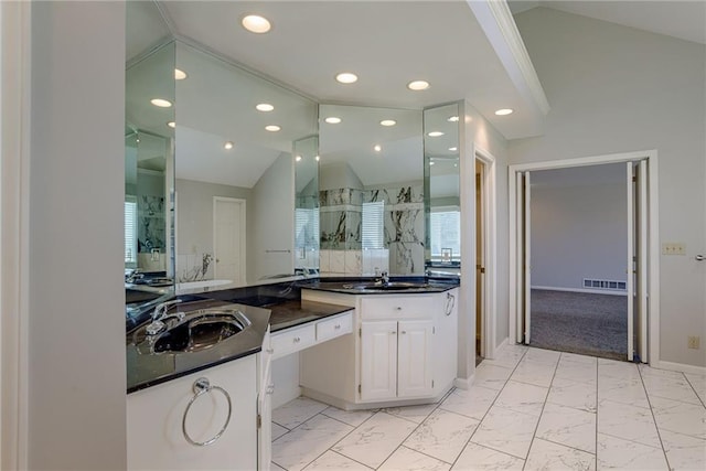 full bath with visible vents, marble finish floor, walk in shower, and lofted ceiling