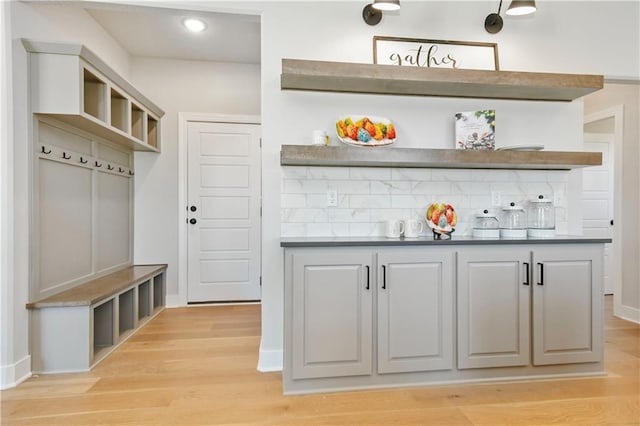 mudroom featuring light wood-style flooring and baseboards