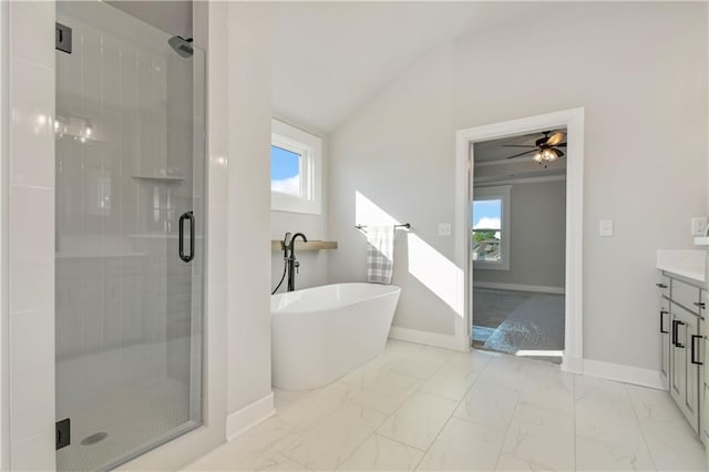 bathroom with marble finish floor, a shower stall, a freestanding bath, and vanity