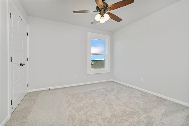 interior space featuring carpet flooring, ceiling fan, and baseboards