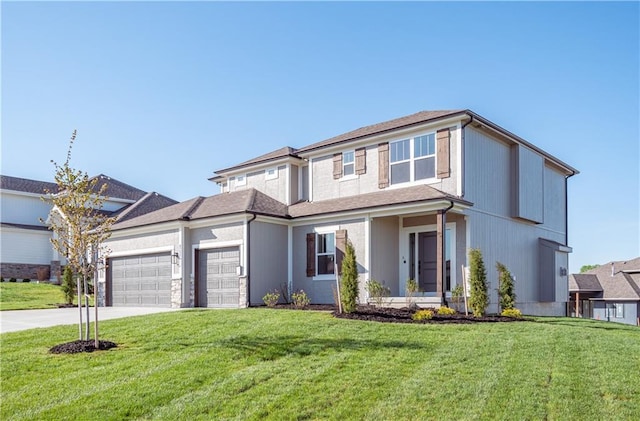 view of front of house featuring a garage, driveway, and a front lawn