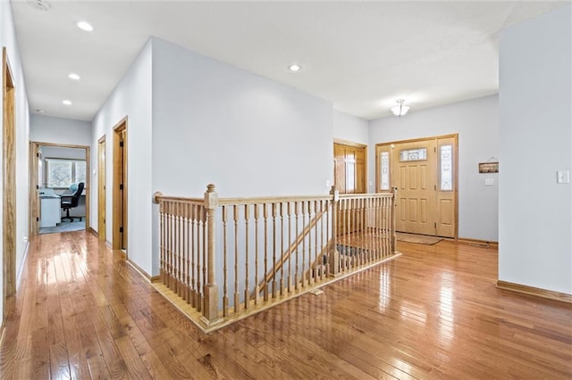 foyer featuring recessed lighting, baseboards, and hardwood / wood-style floors