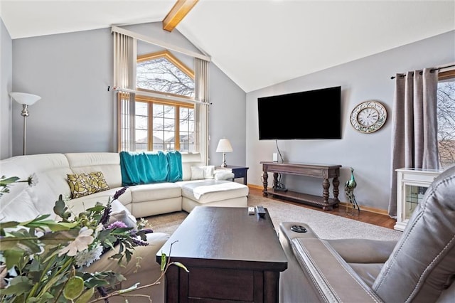 living room featuring lofted ceiling with beams and wood finished floors