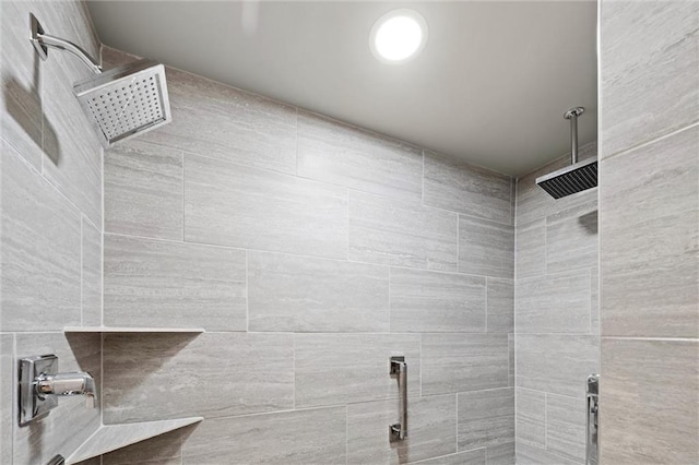 bathroom with a tile shower