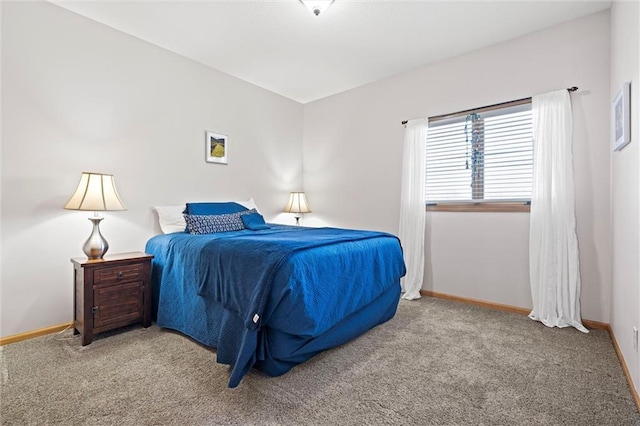 carpeted bedroom with baseboards