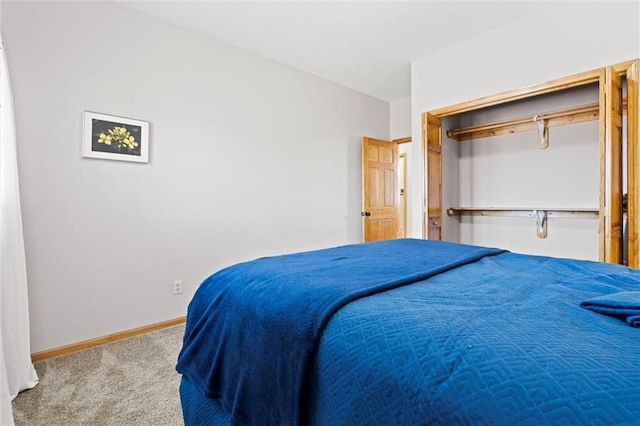 carpeted bedroom featuring baseboards