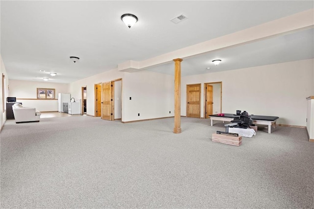 interior space with visible vents, freestanding refrigerator, baseboards, and carpet floors