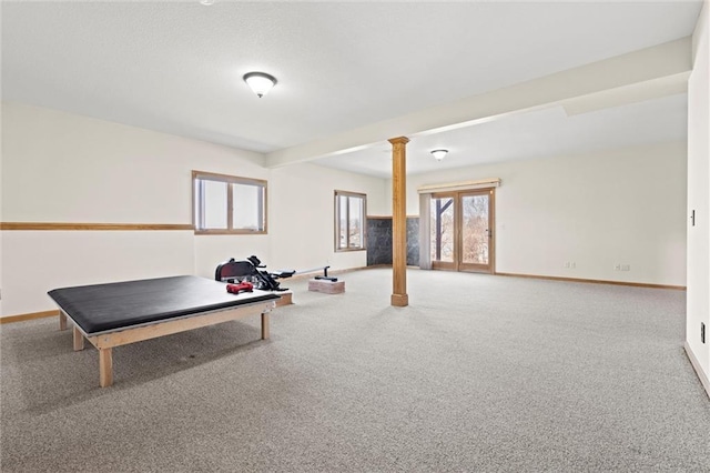 rec room featuring decorative columns, carpet floors, and baseboards