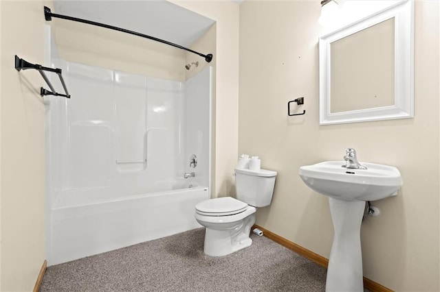 bathroom featuring shower / bathing tub combination, baseboards, and toilet