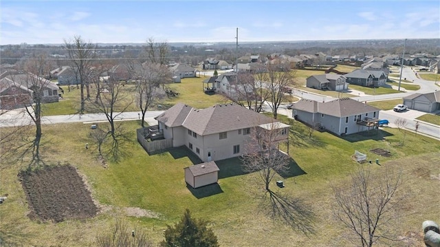 birds eye view of property with a residential view