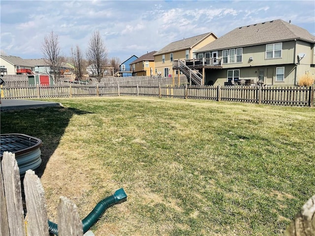 view of yard featuring a residential view and fence