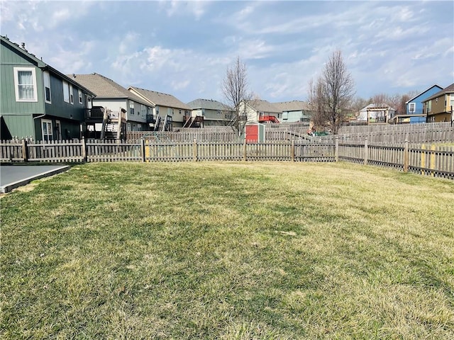 view of yard with a residential view and fence