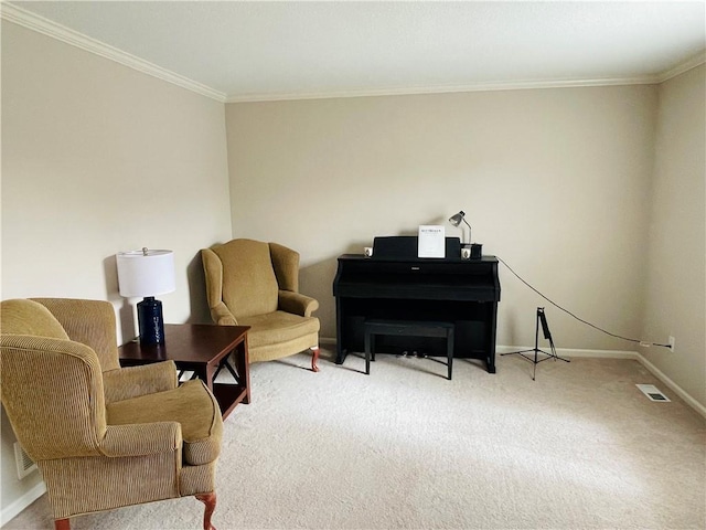 living area with crown molding, visible vents, baseboards, and carpet floors