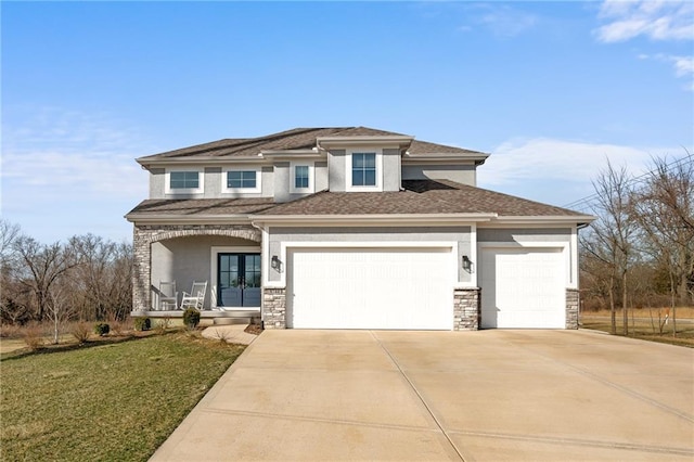 prairie-style home featuring stucco siding, stone siding, french doors, covered porch, and a garage