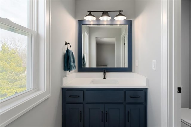 bathroom featuring toilet and vanity