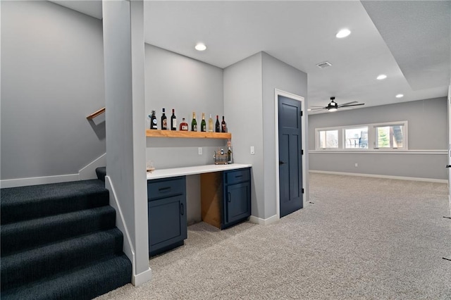 bar featuring baseboards, stairway, light colored carpet, a dry bar, and recessed lighting