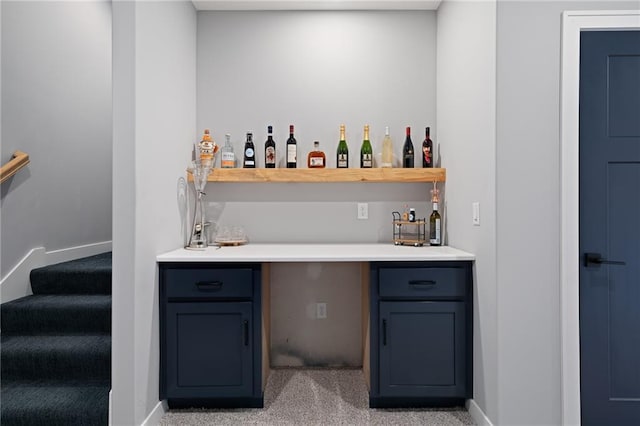 bar with light carpet, stairway, baseboards, and indoor bar