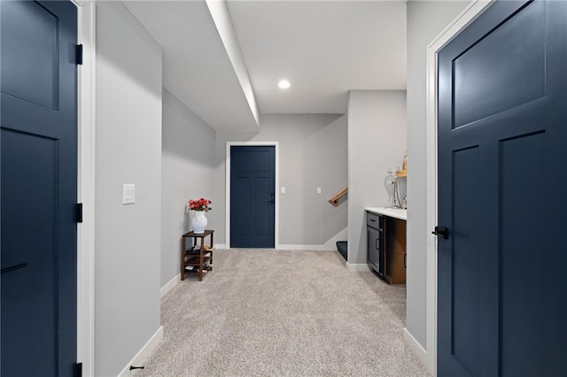 hall with recessed lighting, stairway, light carpet, and baseboards