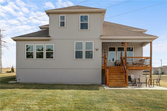 rear view of property with a patio area, stairway, a lawn, and ceiling fan