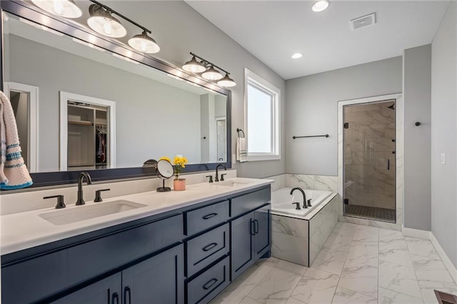 full bath with visible vents, a shower stall, marble finish floor, and a sink