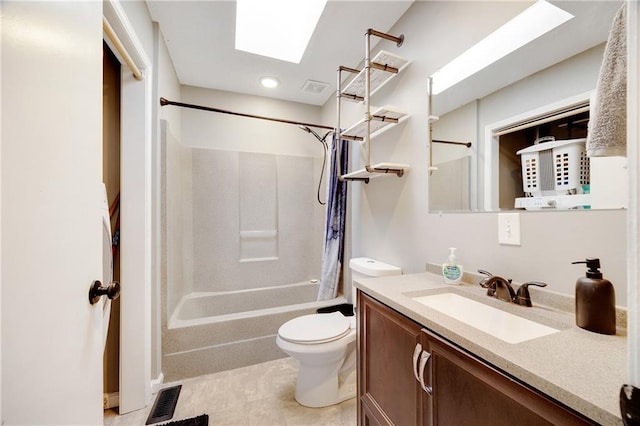 bathroom featuring a skylight, shower / tub combo with curtain, visible vents, toilet, and vanity